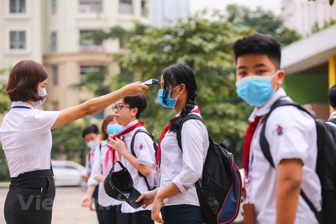 Hanoi students back to school after coronavirus closures