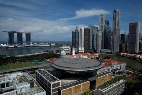 Singapore lowers economic growth forecast