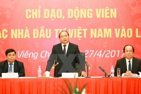 PM praises efforts of Vietnamese investors in Laos