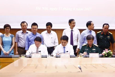 Hanoi, Vietnam News Agency ink cooperation deal