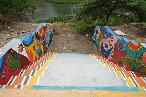 Students create river side art space