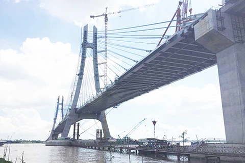 Final sections of Vam Cong bridge spanning Hau River joined