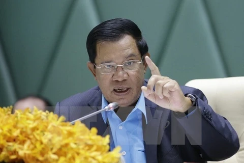 Cambodian PM vows to take hard line with treason
