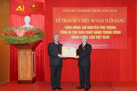 Party chief receives 50-year Party membership badge 