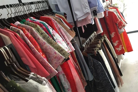 Young people shop for affordable, ready-to-wear ao dai for Tet