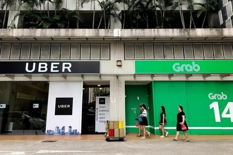 Singapore sets interim measures for Grab-Uber merger