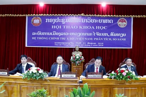 Vietnam, Laos review political system 