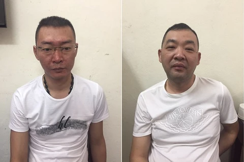 Vietnam hands over two wanted men to China