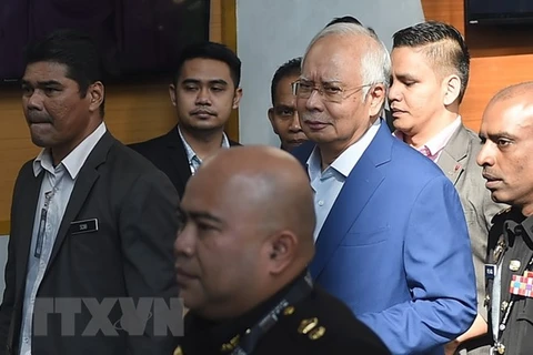 Former Malaysian PM brought to court over corruption scandal