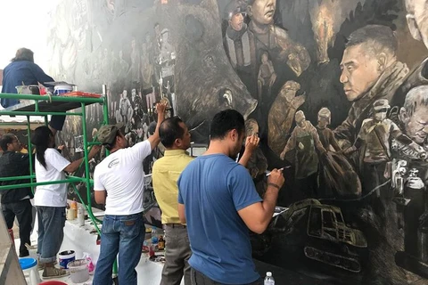 Thai artists create artwork telling Tham Luang rescue mission story