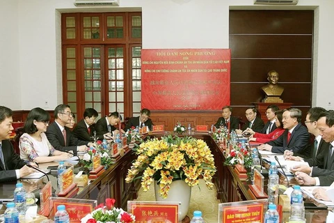 Vietnam, China court sectors enhance collaboration