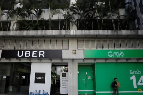 Grab, Uber fined nearly 10 million USD in Singapore