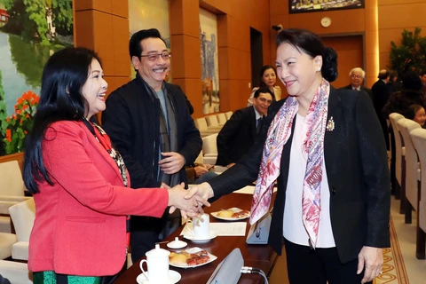 Top legislator meets writers, artists on Lunar New Year