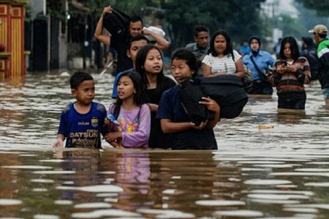 Indonesian floods kill two, force hundreds to evacuate
