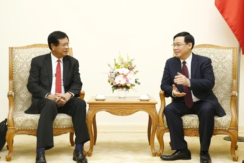 Vietnam shares experience in developing cooperatives with Laos 