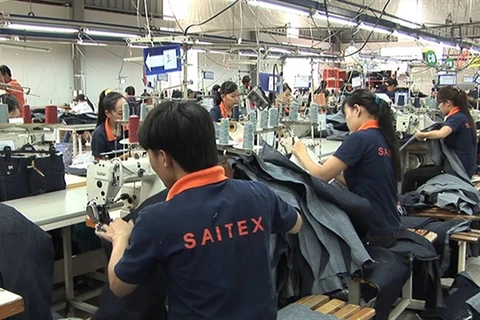 High-level Swiss delegation visits garment factory in Dong Nai