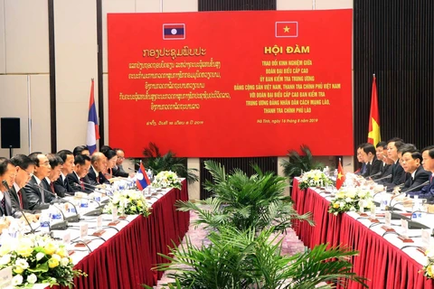 Vietnamese, Lao parties share inspection experience