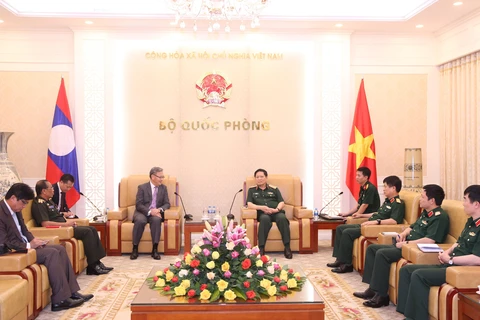 Defence minister hosts outgoing Lao ambassador