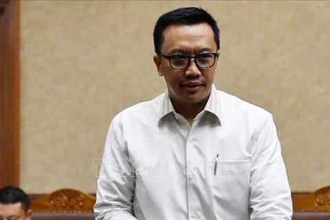 Indonesia’s anti-graft agency detains former sports minister