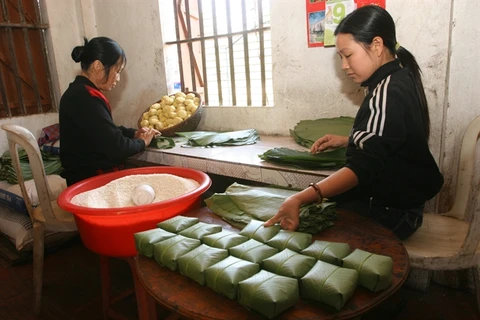 Time for Tet means it's time for a bite of banh chung