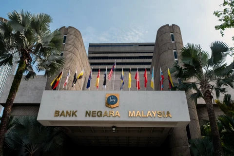 Malaysia lowers key interest rate to support economic growth