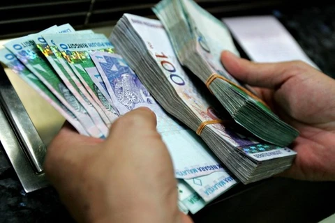 Malaysia widens fiscal deficit target 