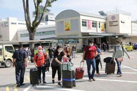 Malaysia, Singapore resume cross-border travel