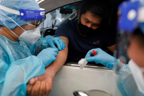 Philippines loosens overseas travel ban on medical workers