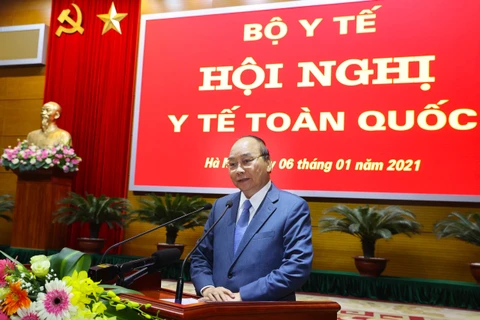 Prime Minister Nguyen Xuan Phuc delivers a speech at the National Health Conference in Hanoi on January 6. (Photo: VNA)