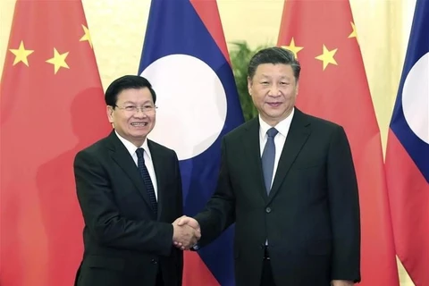 Chinese, Lao leaders seek to boost bilateral relations through phone talks
