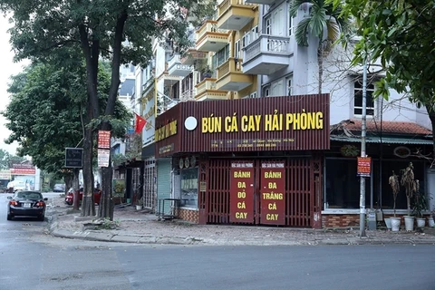 Hanoi orders closure of streetside stalls, religious sites