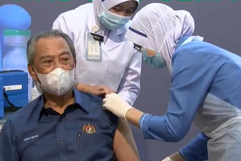 Malaysia begins national COVID-19 immunisation 