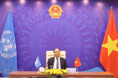 Prime Minister Nguyen Xuan Phuc addresses the UNSC debate from Hanoi (Photo: VNA)