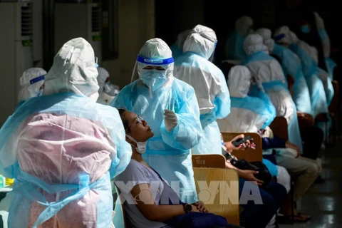 Thailand sees new daily record of COVID-19 deaths, Singapore probing re-infections
