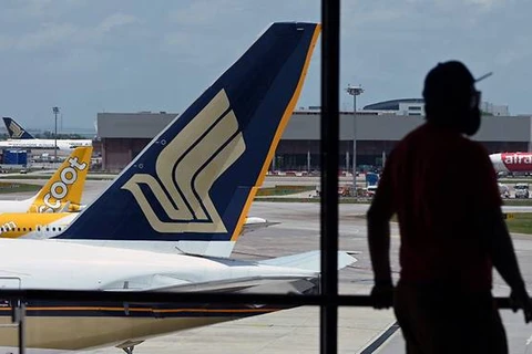 Singapore Airlines reports record annual net loss