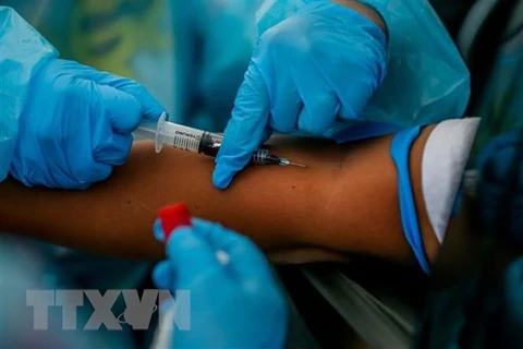 Philippines targets workers in next phase of COVID-19 vaccination 