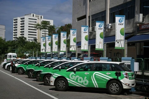 Grab to give commuters choice of electric or hybrid vehicles