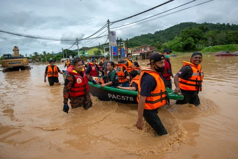 Seven dead, more than 50,000 evacuated in Malaysia floods