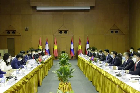 Vietnam, Laos hold ninth foreign ministerial-level consultation meeting