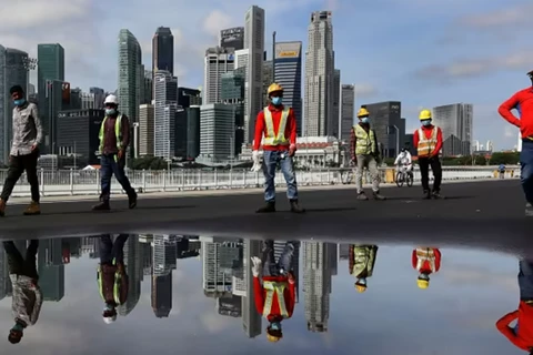 Singapore continues loosening COVID-19 restrictions against migrant workers