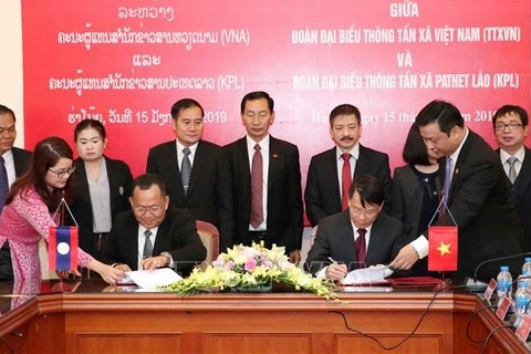 Heartfelt relations between news agencies of Vietnam, Laos