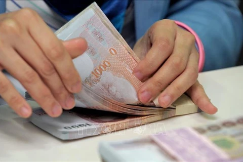 Thai baht surges on prospect of tourism recovery