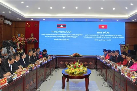 Hanoi, Vientiane fronts foster cooperation