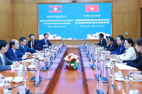 Vietnam, Laos to step up sharing mass mobilisation experience