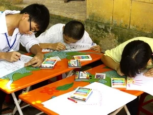 Blind students at a painting contest of the festival (Source: VNA)