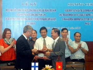 The signing ceremony (Source: VNA)