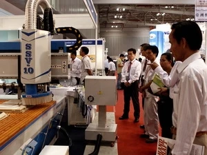 An pavilion in the 2011 Vietnam Woodworking Industry Fair (Photo: VNA)