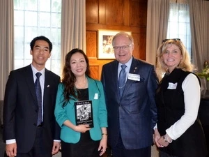 Dr. Nguyen Dai Trang (centre) with her book (Source: VNA)
