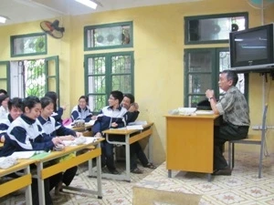 At a classroom (Source: VNA)