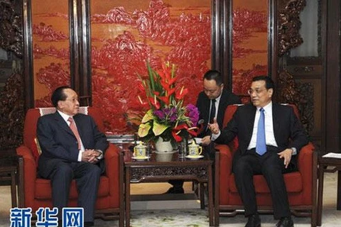 Chinese Premier Le Keqiang (right) and Cambodian Deputy Prime Minister and Foreign Minister Hor Namhong (Photo: News.cn)